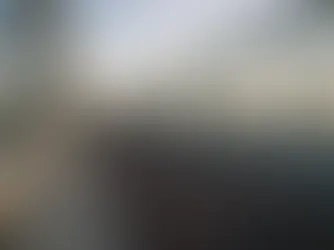 Bridge walkway lines leading forward at golden hour with open sky space, suggesting a clear next step after a crash.