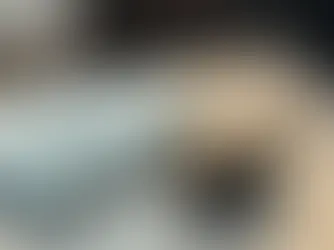 Smartphone with a blurred map pin beside car keys on a clean surface, with wide space for a blog headline.