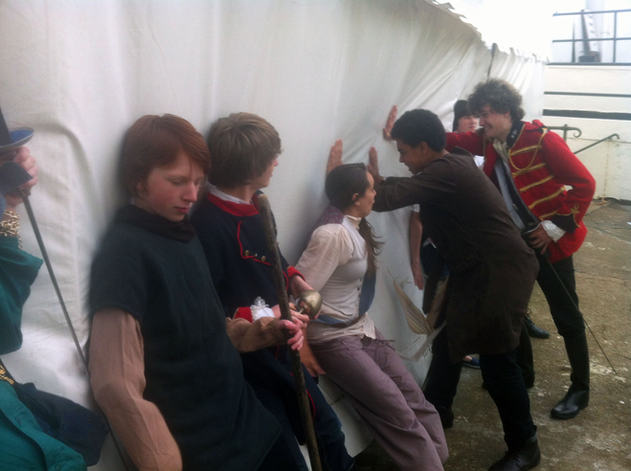 Stopping the audience canopy from blowing away.