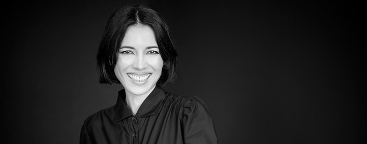 Headshot of Rika Sawatsky against black background