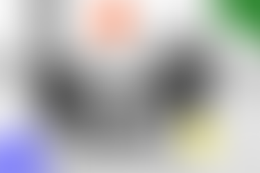 blurred out black and white photo of office meeting with branded coloured icon overlay