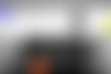 black and white photo of boardroom, with branded coloured icon overlay