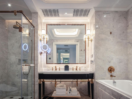 Modern remodeled bathroom with updated lighting, tile, and vanity in a Portland home