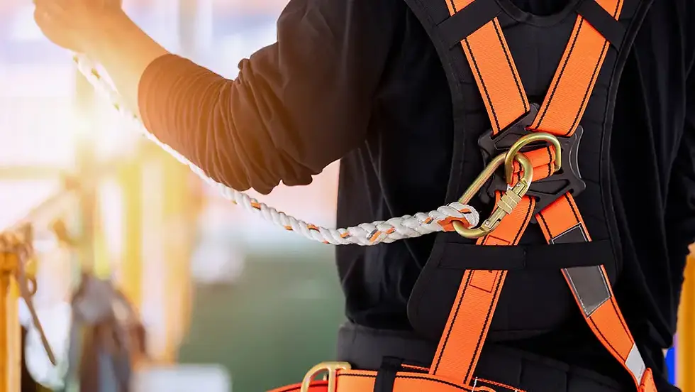 Worker in safety harness connecting a lifeline