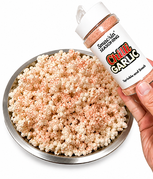 Chilli Garlic seasoning shaker over a bowl of popcorn