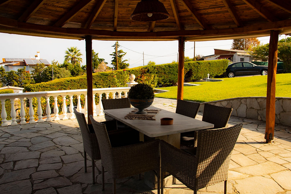 Close-up view of a cozy outdoor dining area in a Peraia summer home