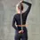 Thumbnail:  Gaiam® Restore Stretch Strap. Woman has strap behind back.