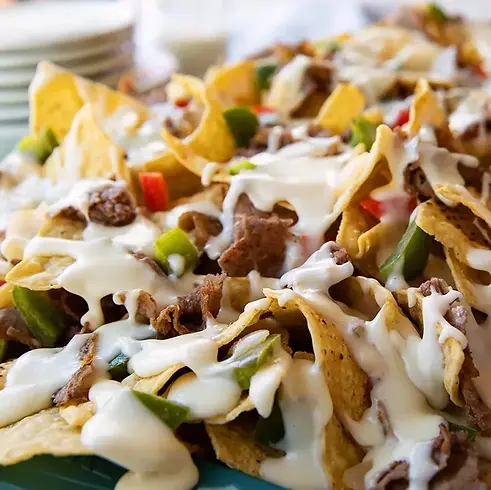 20240314201916-philly-cheesesteak-nachos.webp