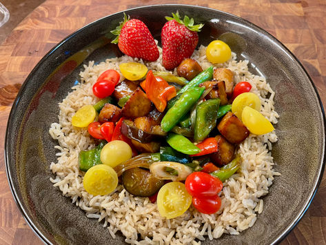 A grain bowl with Asian vegetables and fresh cherry tomatoes