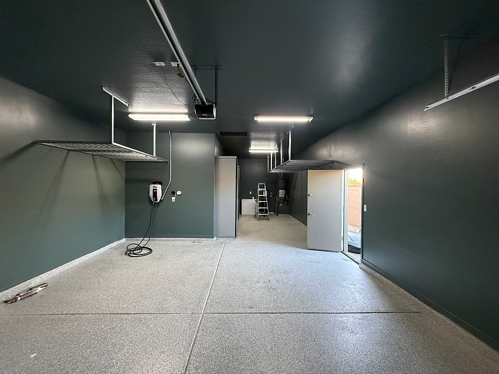 Eye-level view of freshly painted garage interior with smooth gray walls and clean floor