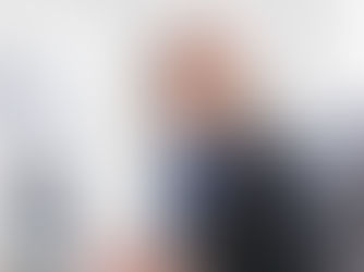 middle aged woman working on a computer at a desk