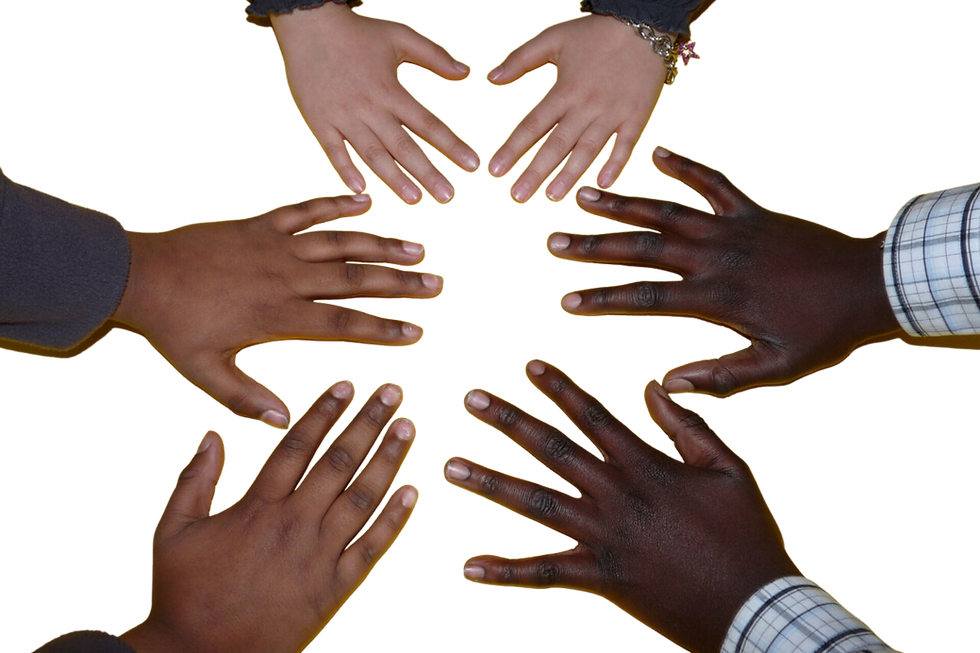 Six hands of diverse skin tones reach towards each other in a circle over a dark background, symbolizing unity and diversity.