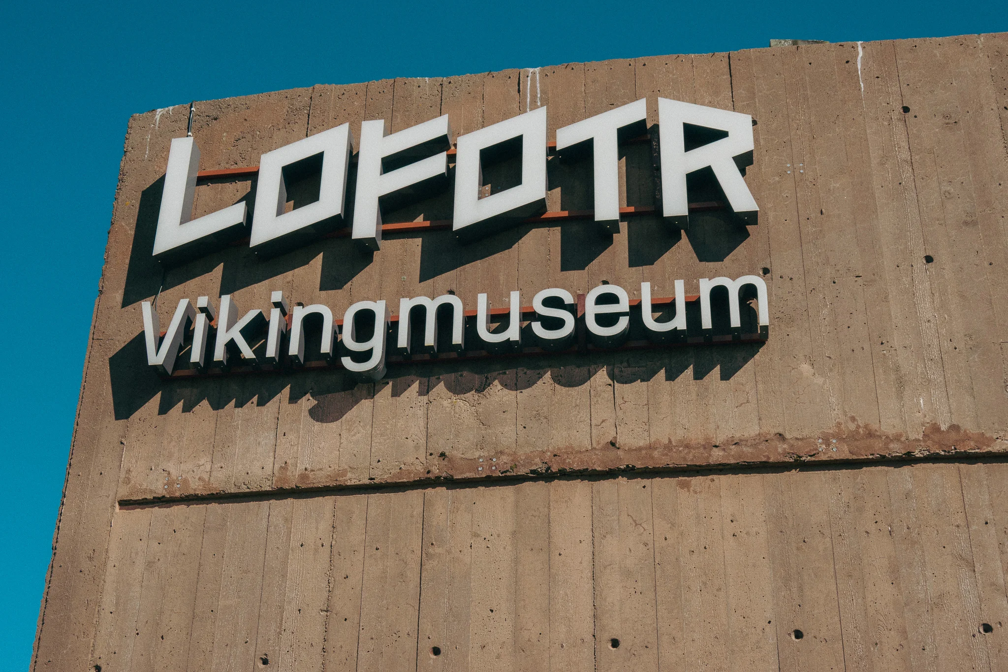 Lofotr Viking Museum on the side of a grey stone building