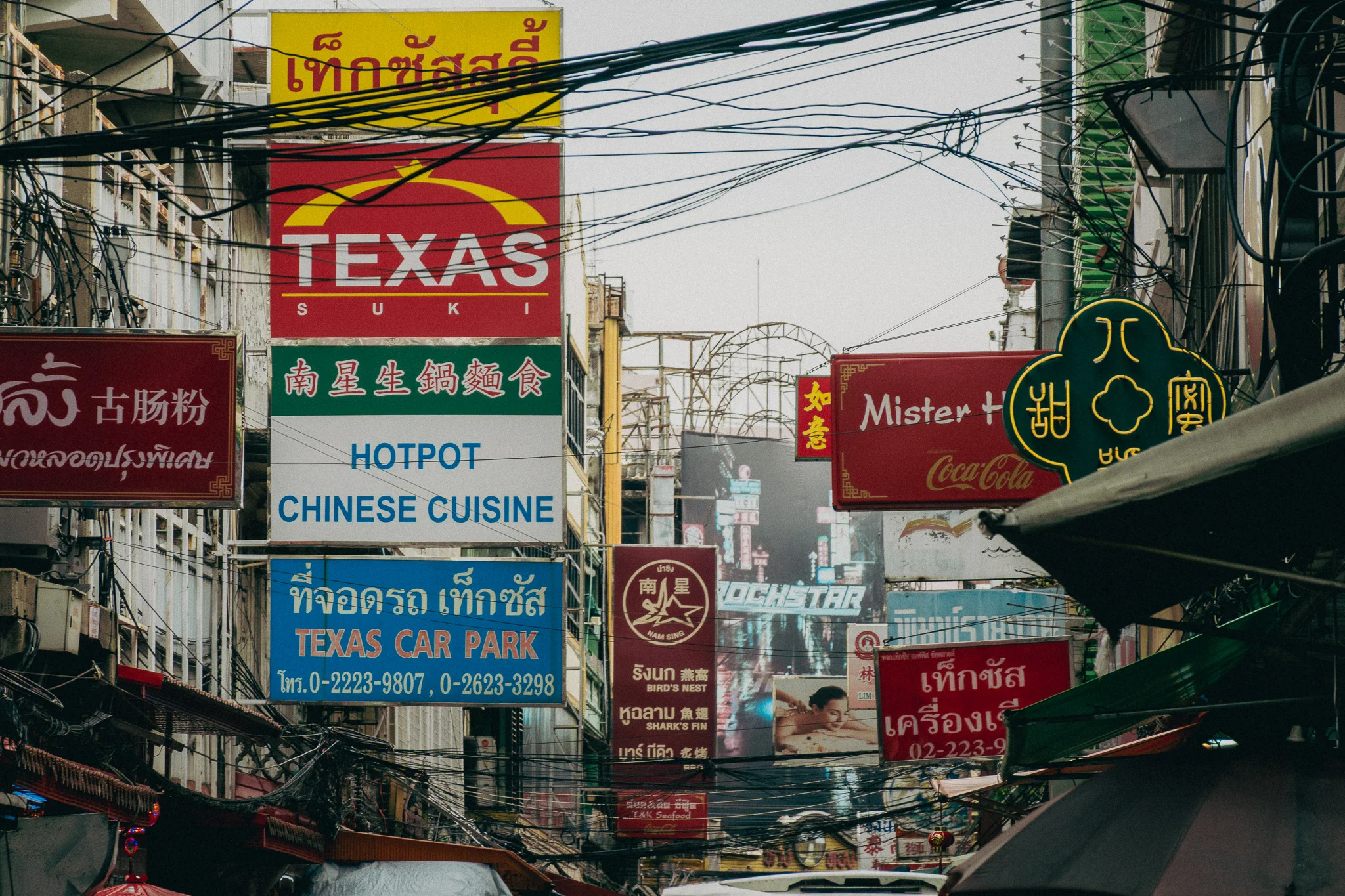 City street and restaurant signage in Bangkok Thailand