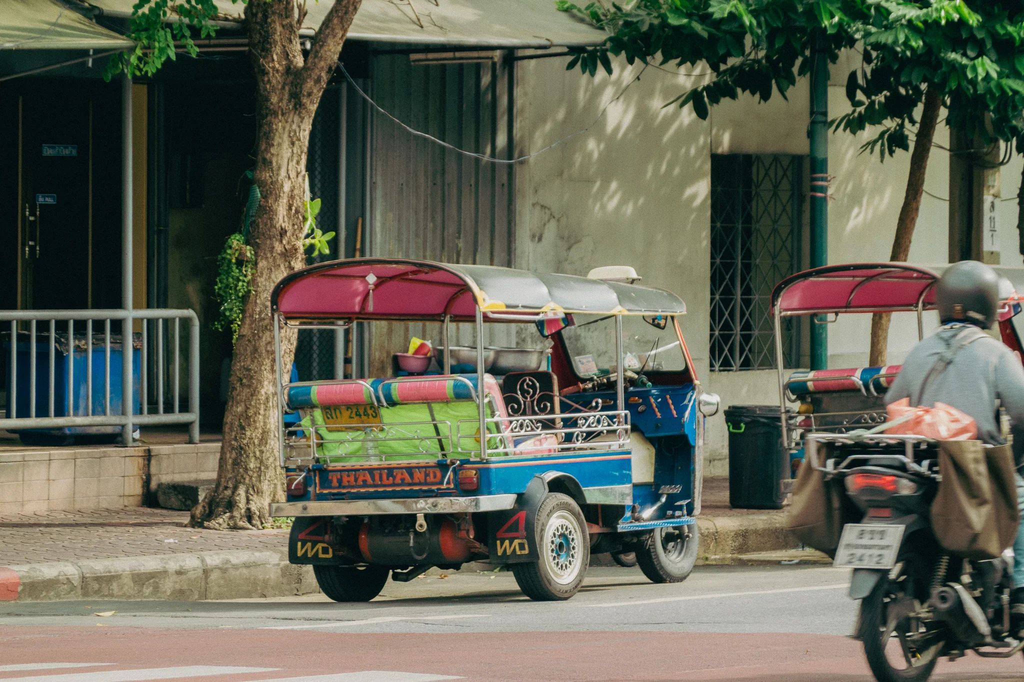Yellow and Blue tuk-tuk on the streets of Bangkok