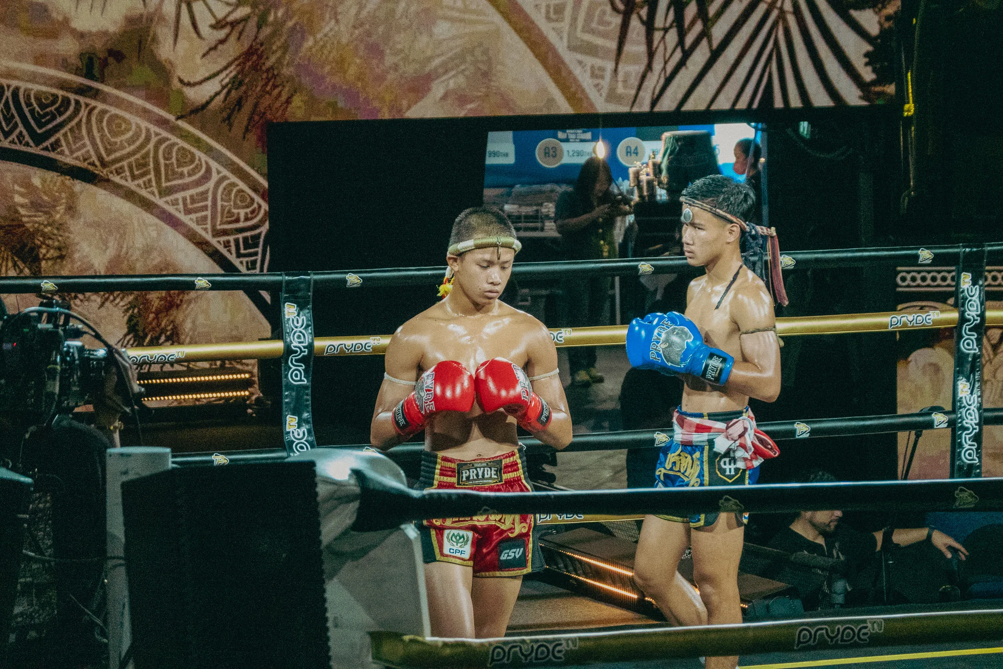 Muay Thai Fighters walking around the ring