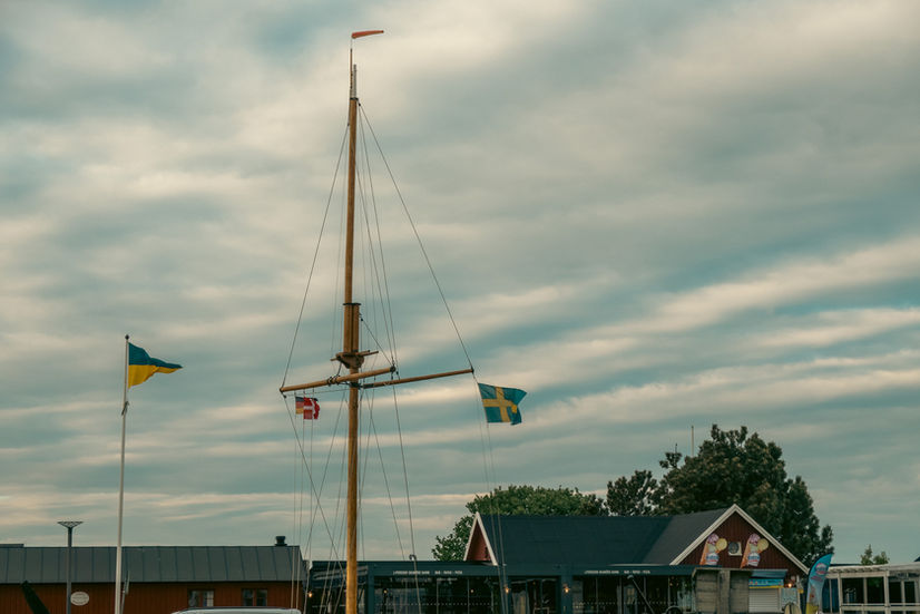 The Skanör Marina mast and flags at sunset in Sweden