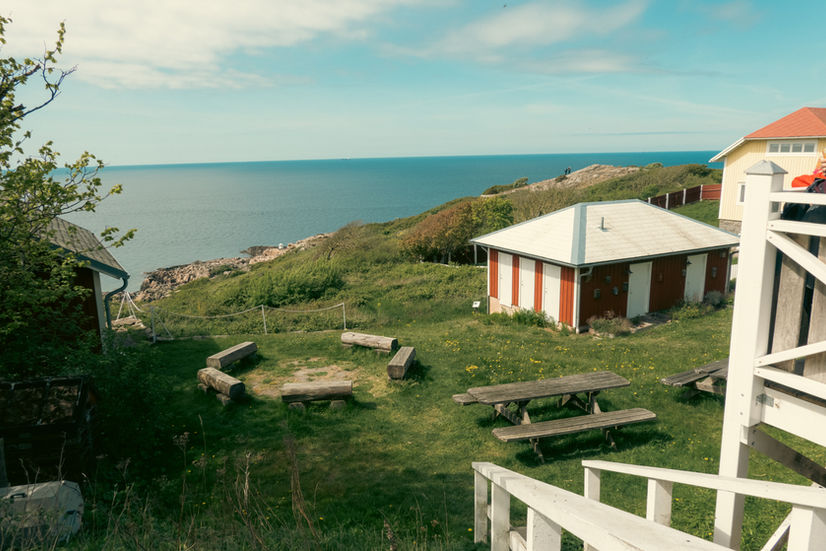 A small cottage and buildings overlooking the North Sea in the Kullaberg national preserve