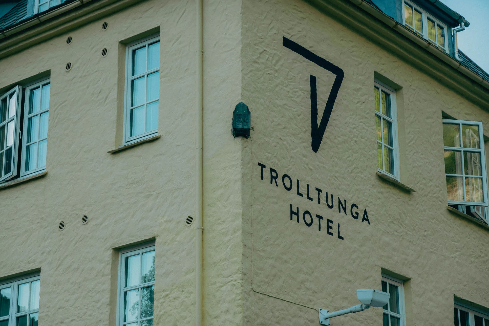 Trolltunga hotel logo on the side of the building surrounded by windows