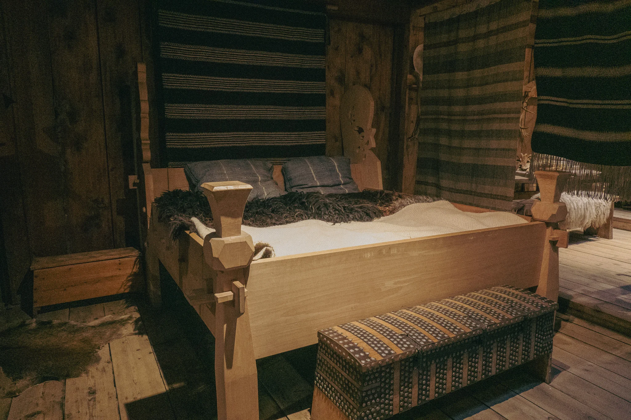 Traditional Viking sleeping quarters on display in the Lofotr Viking Museum