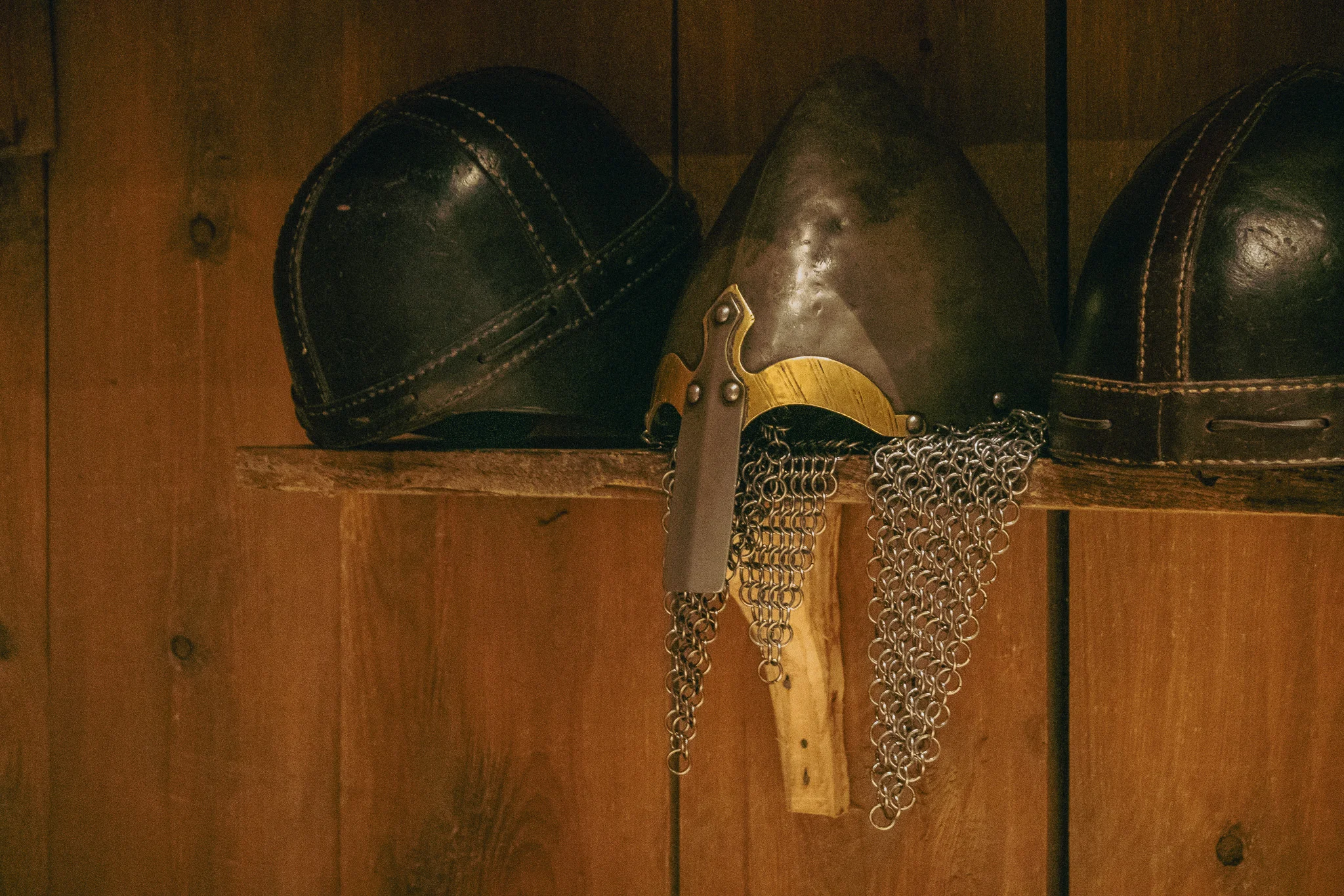Traditional Viking helmets on display in the Lofotr Viking Museum