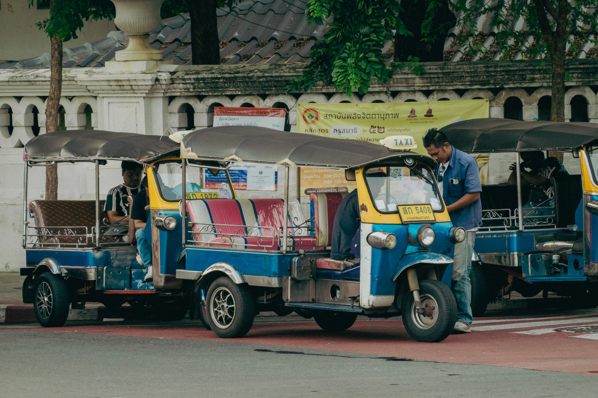 Yellow and Blue tuk-tuk on the streets of Bangkok
