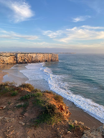 Algarve Coastline, cliff and surfers