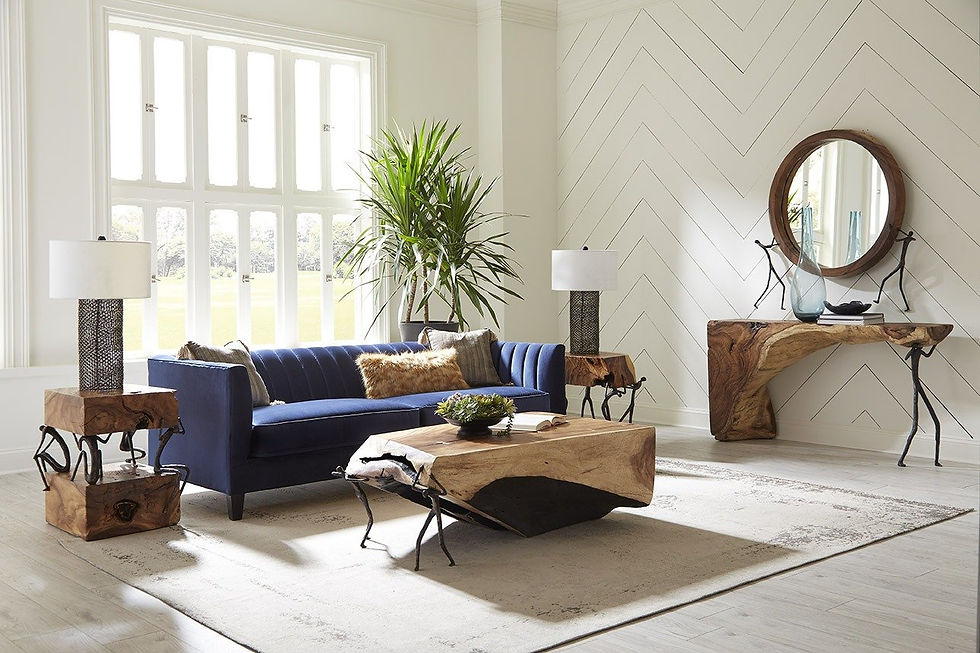 Living room featuring blue furniture and wooden tables, designed by Phillips Collection.