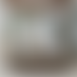 A round outdoor table with chairs beneath an elegant chandelier, designed by Butler Specialty Company.