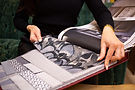 midsection-woman-choosing-textile-home.jpg