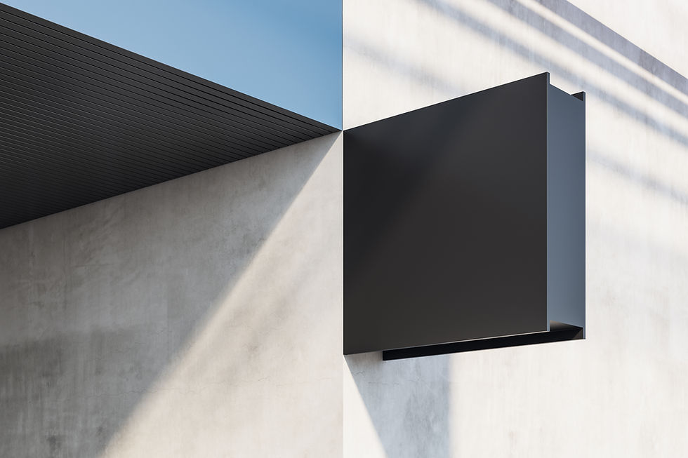 Modern concrete wall with black rectangular panel and shadow