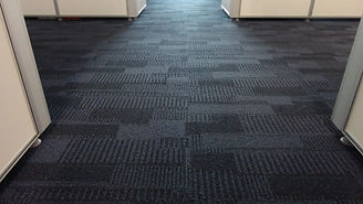 Blue color fabric background. Dark blue carpet pattern interior for the office design.jpg