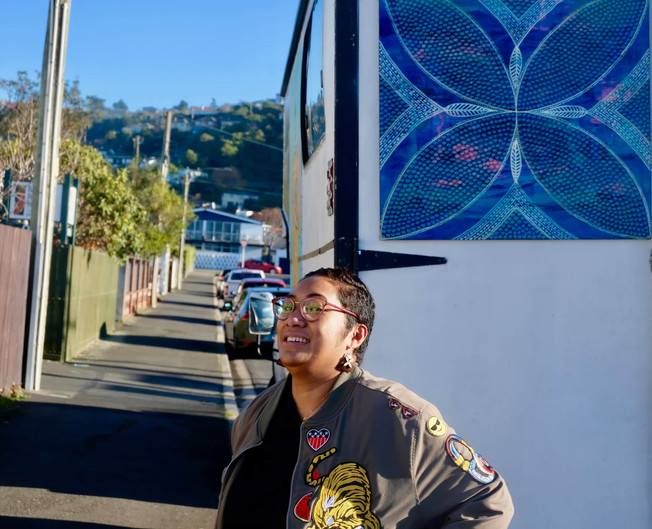 Ana Teofilo adding her artwork to the truck