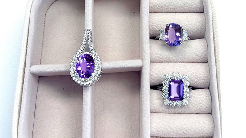 tanzanite jewelry stored in a fabric-lined jewelry box