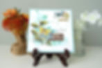 green leaves with yellow butterfly fluttering over them, blue butterfly in top right with Forever More message