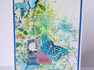front of 5" x 7" card showing 3D butterfly embellishment against a blue/green botanical background