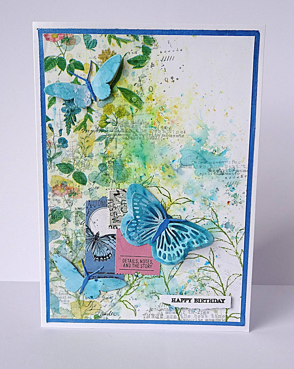 front of 5" x 7" card showing 3D butterfly embellishment against a blue/green botanical background