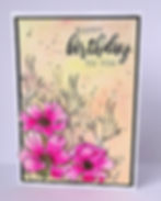 orange peach background with 3D pink cosmos flowers in bottom left corner, happy birthday message top right corner