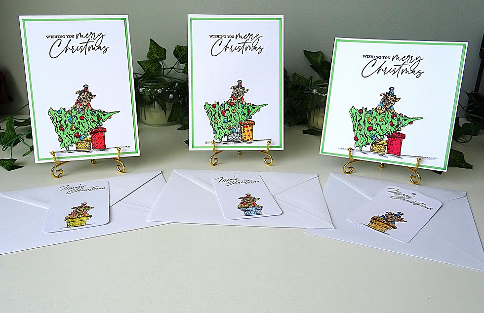 Set of three Christmas cards featuring dogs in a Christmas tree fallen over on presents