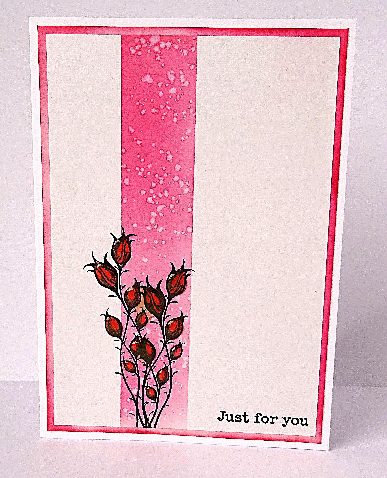 bunch of red flower buds with 3D glaze over buds against a pink strip down card, pink trim around edge, Just For You message