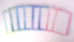 various colour notepads laid out in a fan style