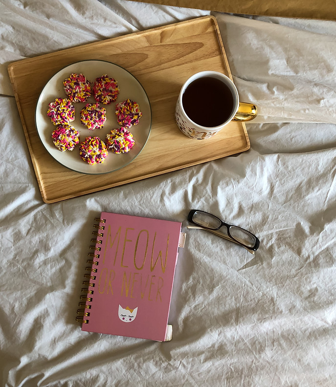 Breakfast in bed, pink cookies, morning food, colorful pastries on wooden tray, hot americ