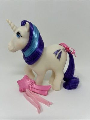 With Comb and Ribbon (not the one shes wearing) -- Source: Worthpoint