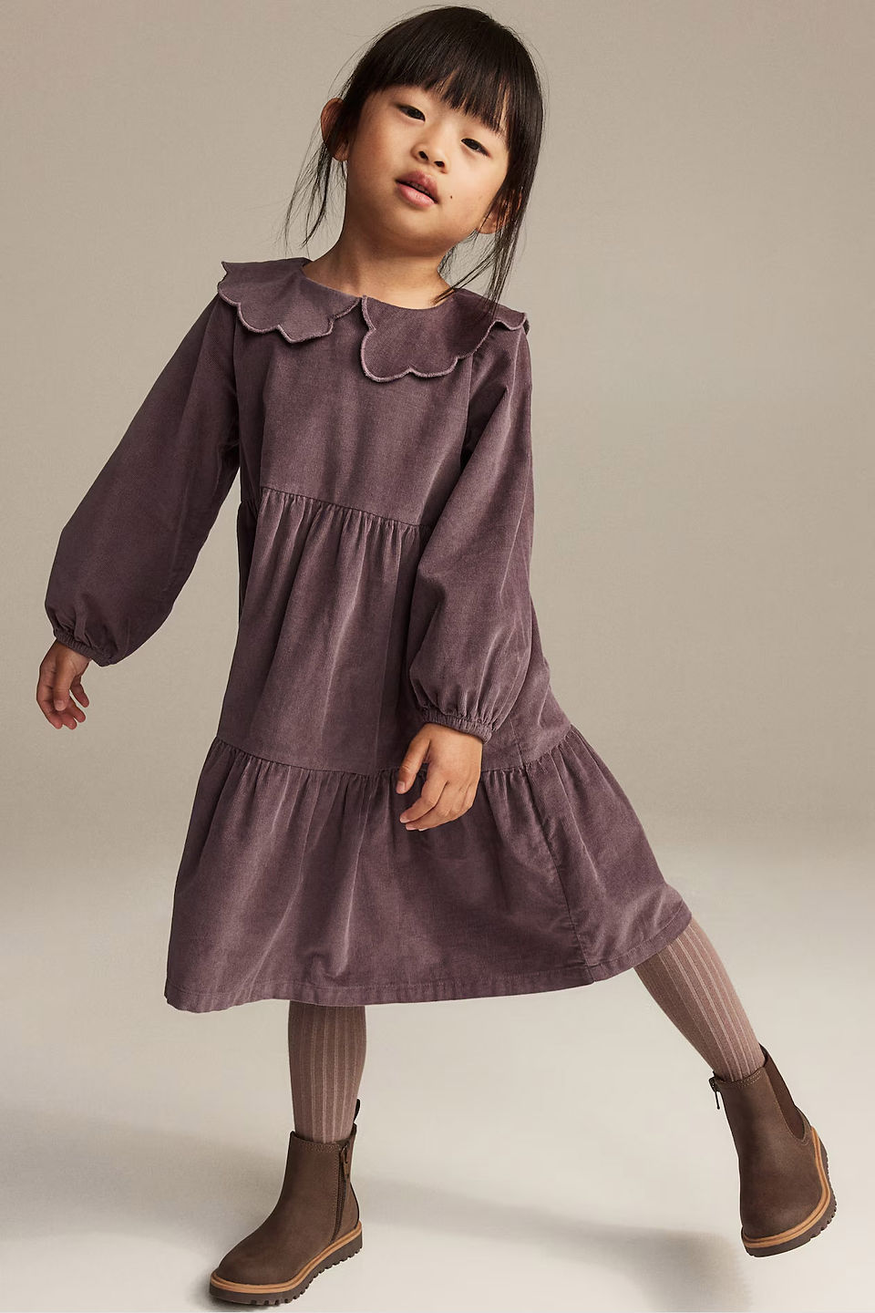 toddler girl in purple courduroy dress