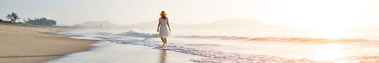 Young woman walking at the beach._edited.jpg