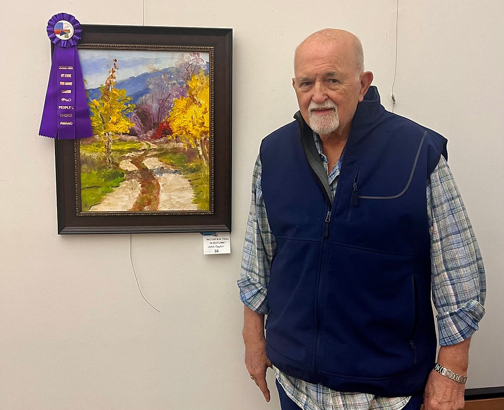 Artist John Taylor with the People's Choice Award Ribbon and his artwork "Mountain Trail in Autumn"