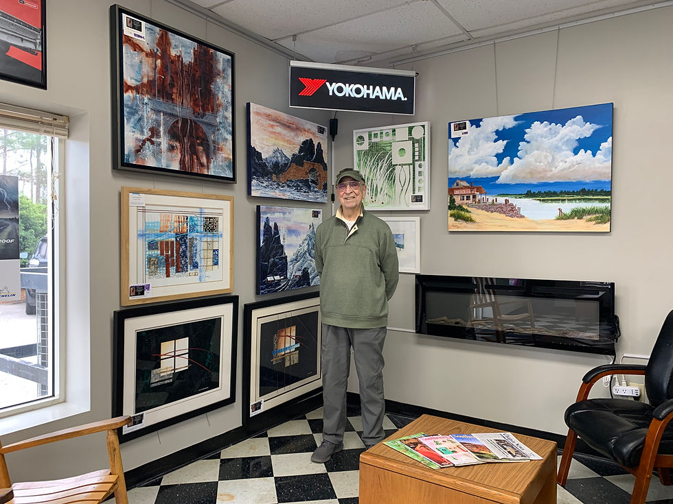 Tommy Thompson setting up the initial gallery display at Lake Murray Tire & Automotive