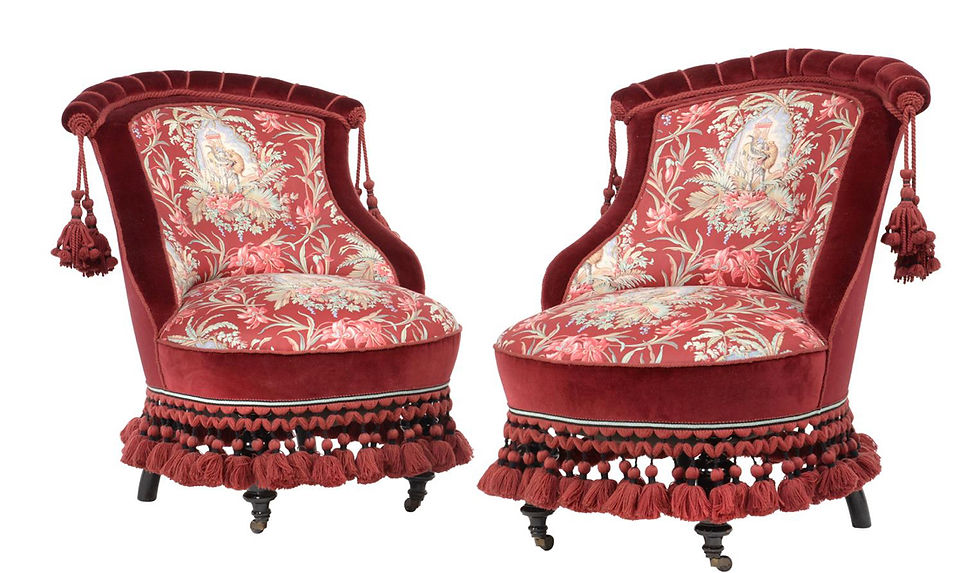 A pair of ebonised low side chairs, circa 1860
