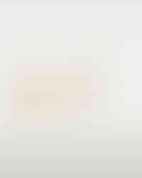 A close-up photo of Cusuti Exaggerated Gold Lip Dangle Earrings which dangle from a clasp of gold-plated environmental brass.