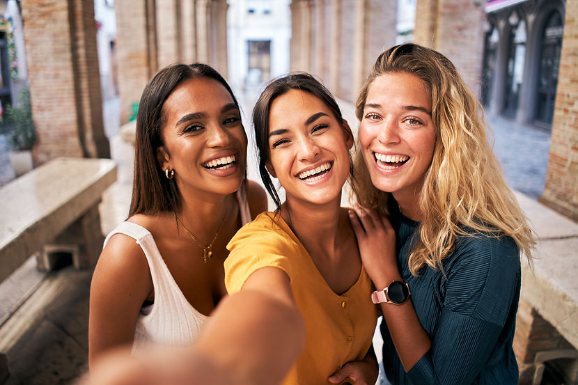 Three young smiling 20s young girls in summer clothes. Women taking selfie self portrait p
